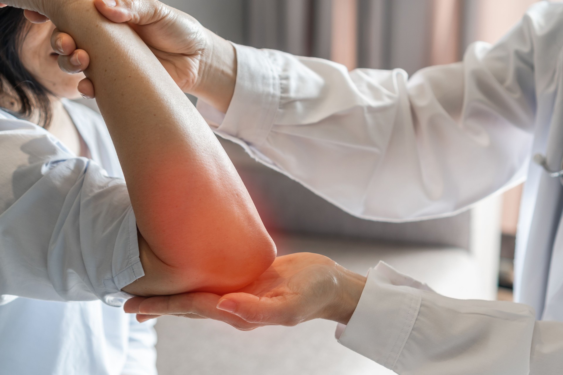 Rheumatism elbow pain, sore, cramp, numb, rheumatoid arthritis, osteoarthritis in woman patient having physical therapy consultation at orthopedic or physical therapist clinic