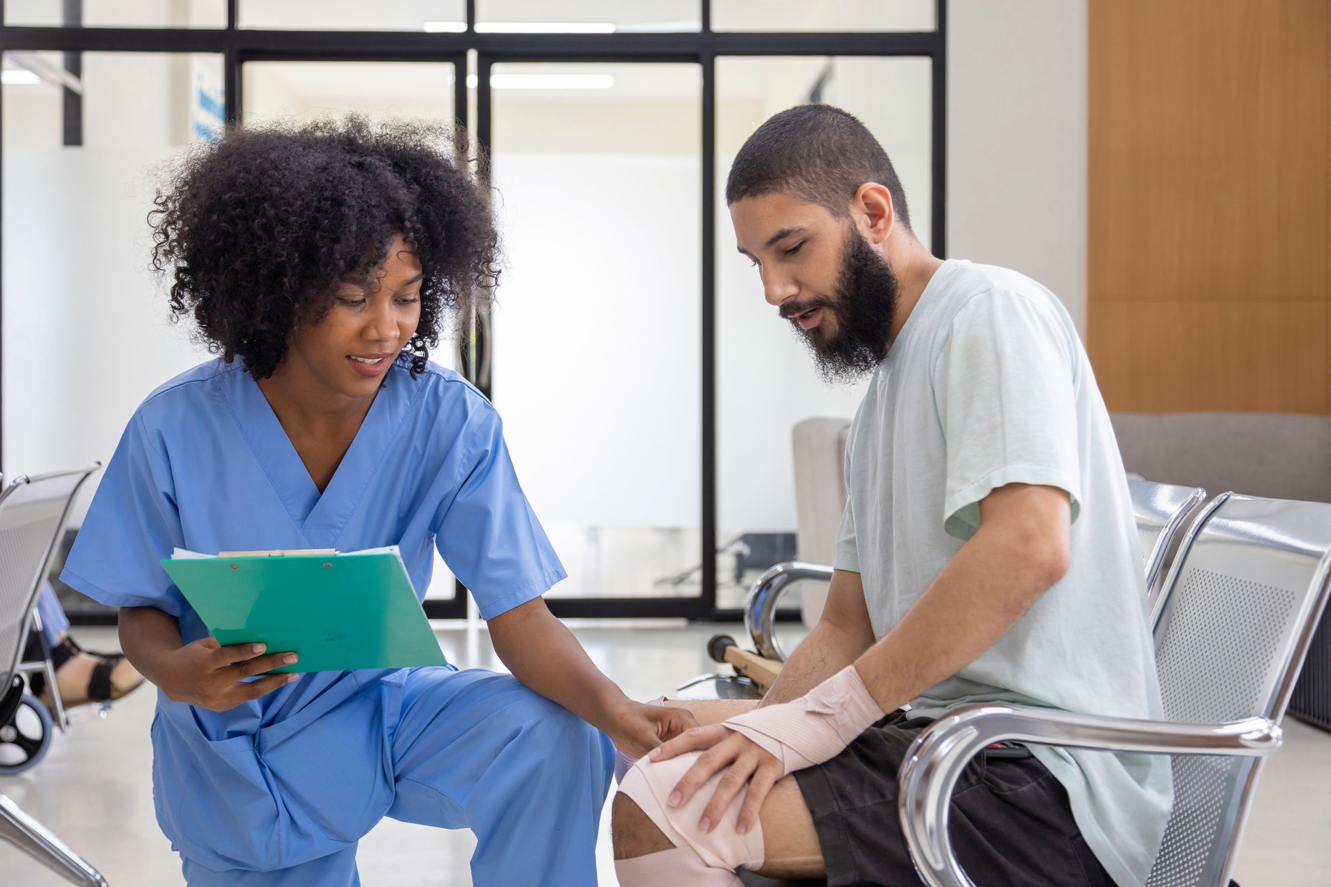 African nurse is examining tendinitis on knee injury from sport accident in Middle East patient for treatment and rehabilitation process