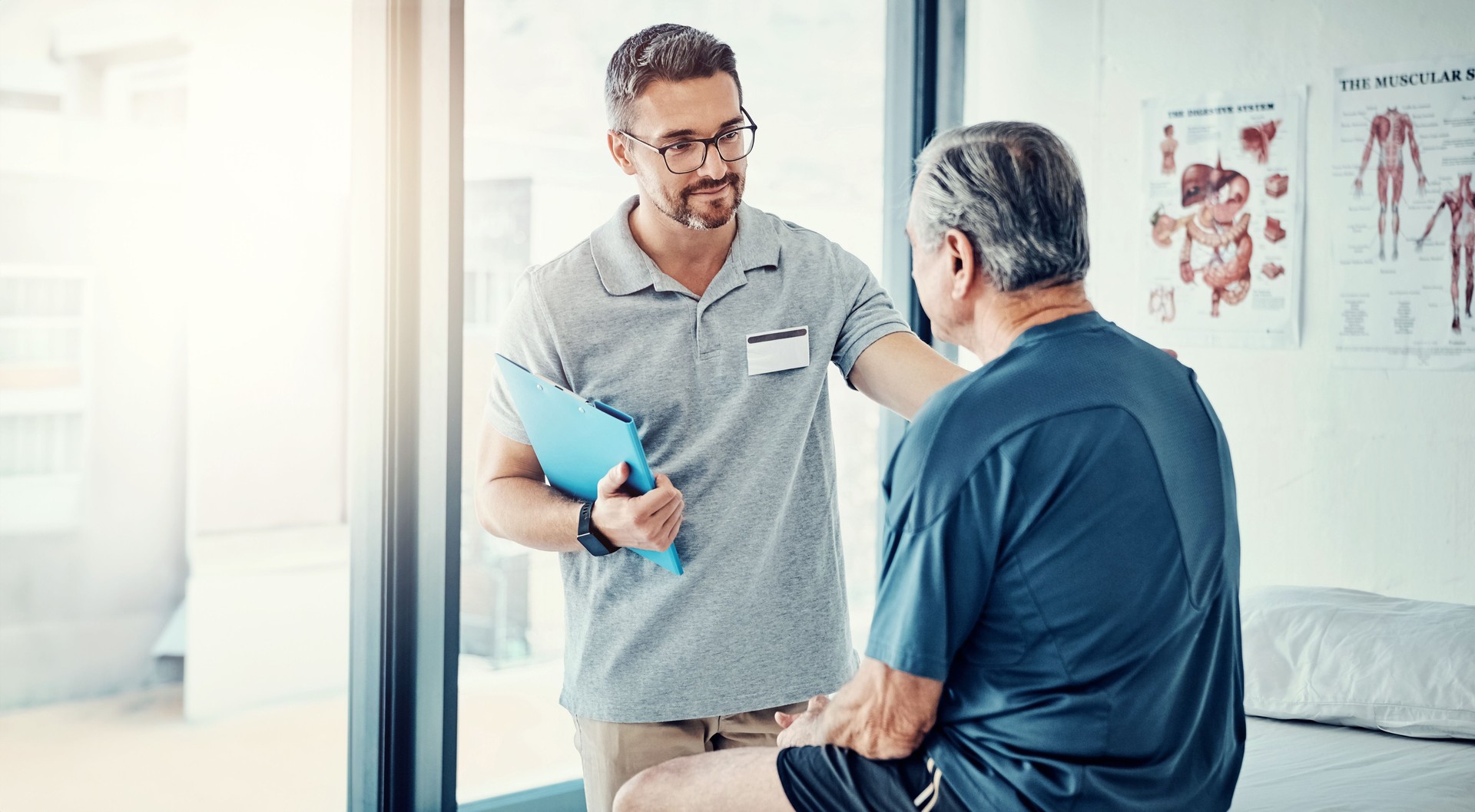 Physiotherapy, chiropractor and senior man in consultation for rehabilitation, recovery and treatment. Healthcare, physical therapy and person with patient for medical service, wellness and support