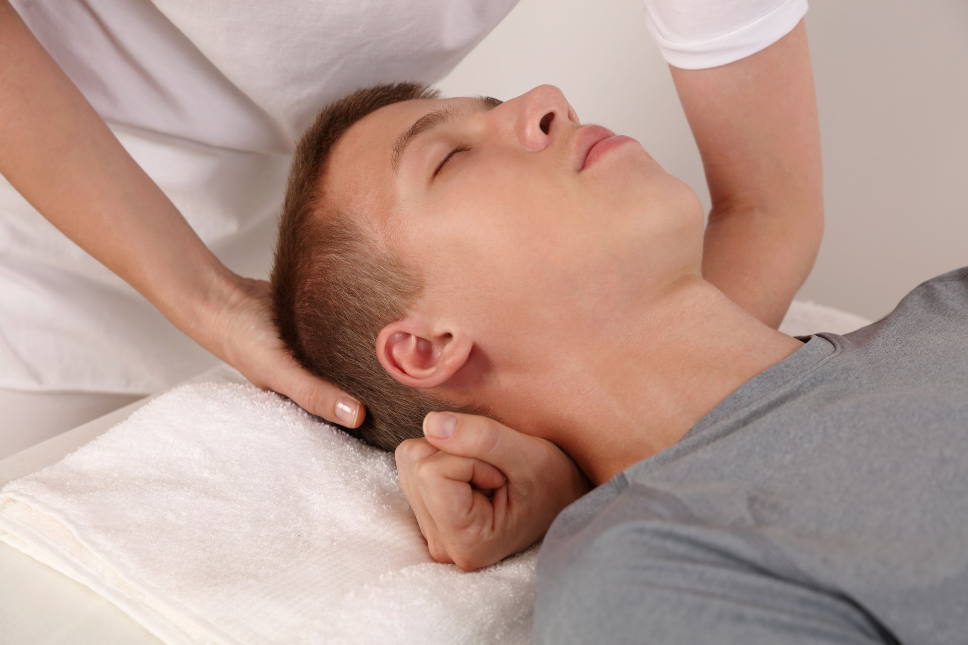 Craniosacral therapy for adolescent. Holistic approach Alternative Medicine concept